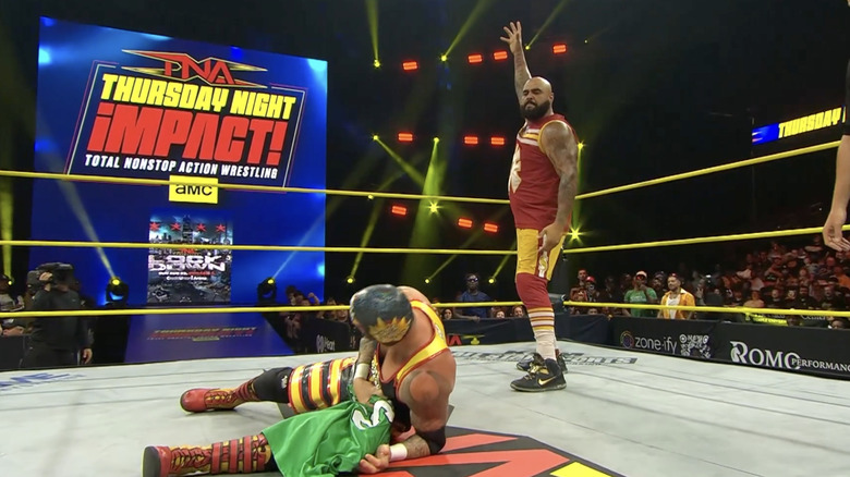 Francis standing over Home Town Man in the ring