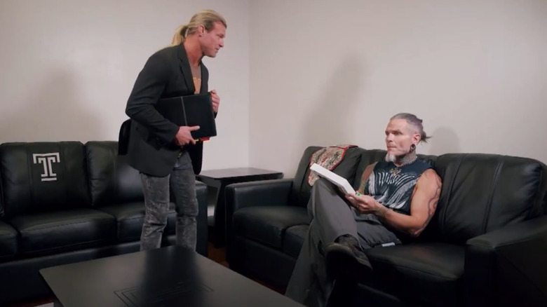 Nic Nemeth speaking while Jeff Hardy sits on a couch