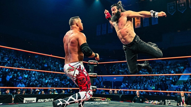 Elijah flies off the top rope