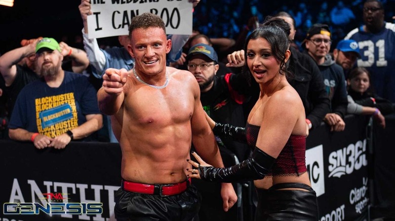 Stacks pointing with Arianna Grace by his side