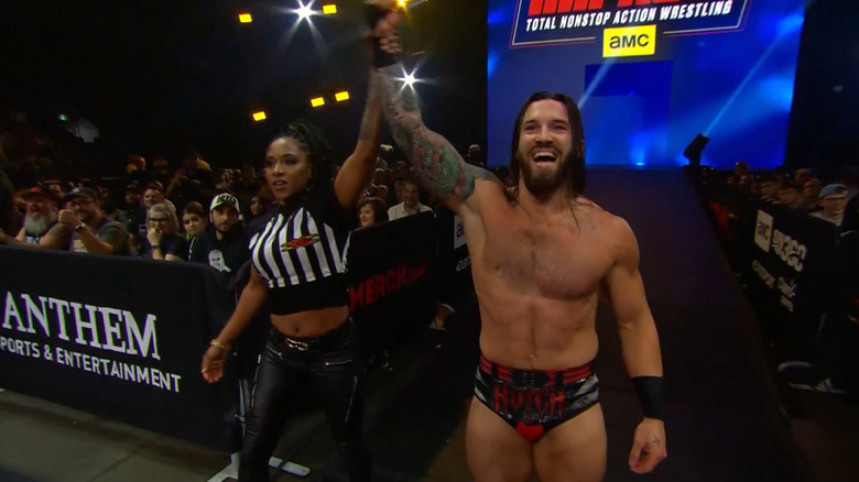 Jason Hotch and Tasha Steelz celebrate at ringside