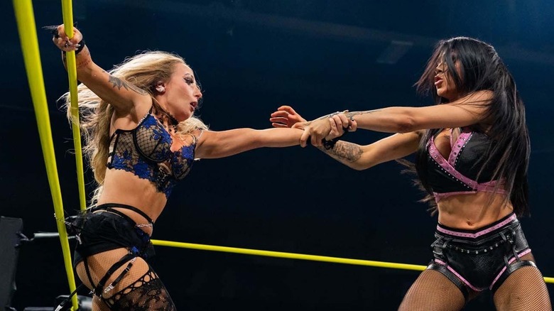 Elayna Black drags Heather by Elegance out of the corner during their match