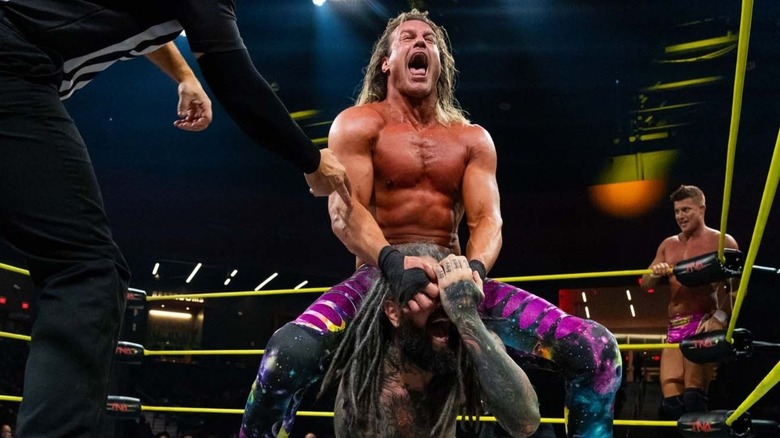 Nic Nemeth puts a member of The Righteous in a submission hold as his brother, Ryan, looks on during a tag team match on an episode of 