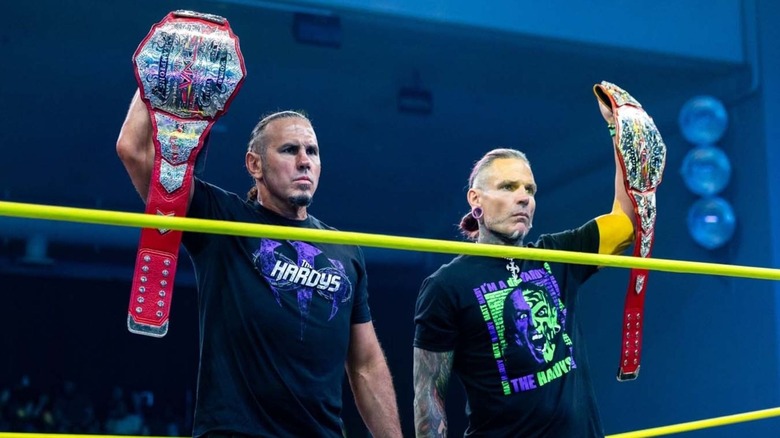 Matt and Jeff Hardy raise their TNA World Tag Team Championships in the ring as they stare down The Righteous during a confrontation on 