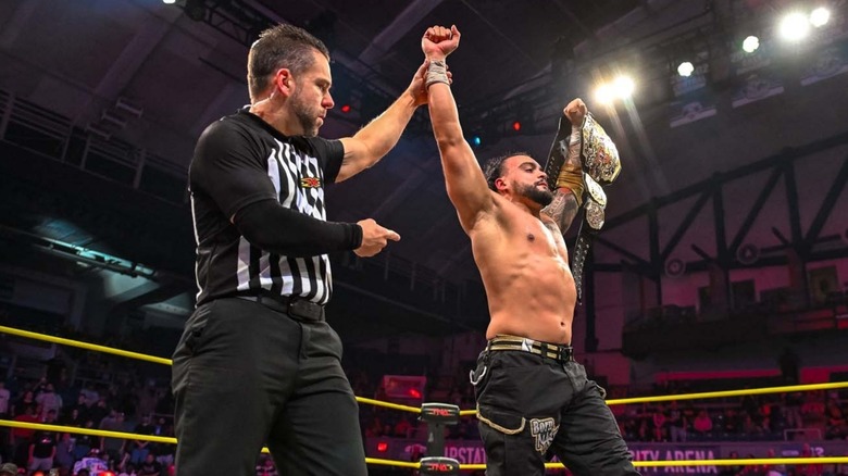 Mike Santana after retaining the TNA World Title against Rich Swann