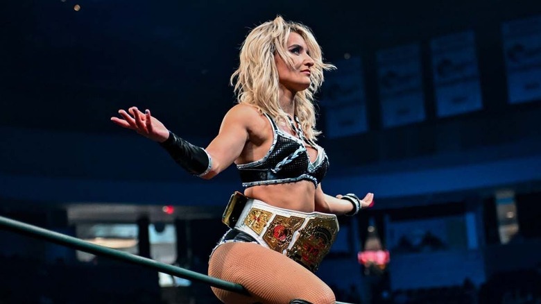 Xia Brookside takes in the admiration after winning the Knockouts World Championship at TNA Slammiversary