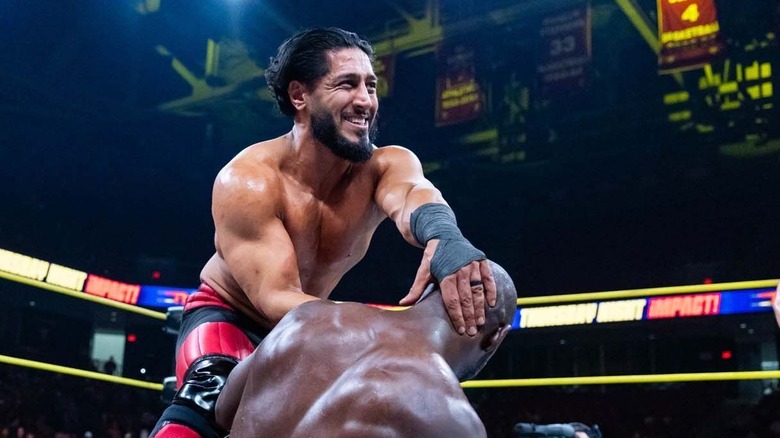 Mustafa Ali locks grabs his opponent