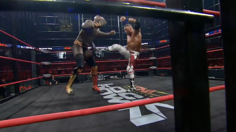 Kazarian delivering a boot to Moose's midsection