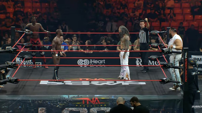 All four men in and around the ring