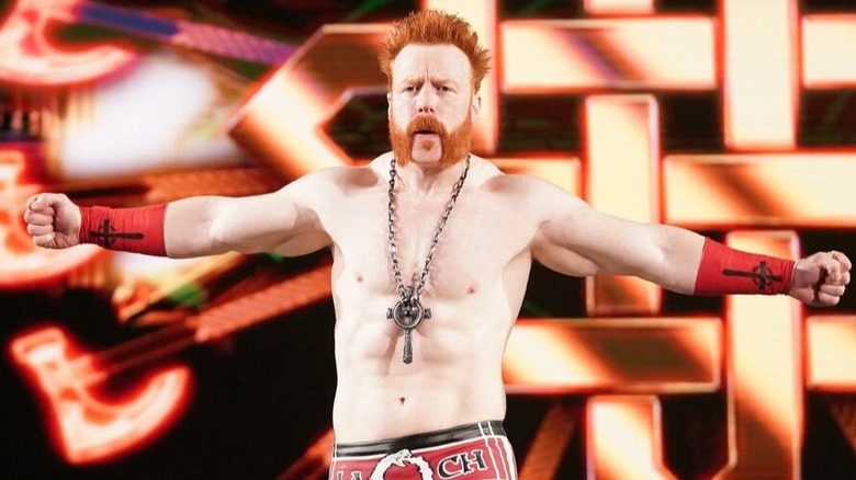 Former WWE star Sheamus spreads his arms out at the top of the entrance ramp ready to fight