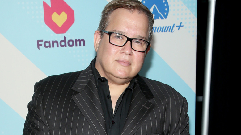Scott D'Amore is wearing a suit