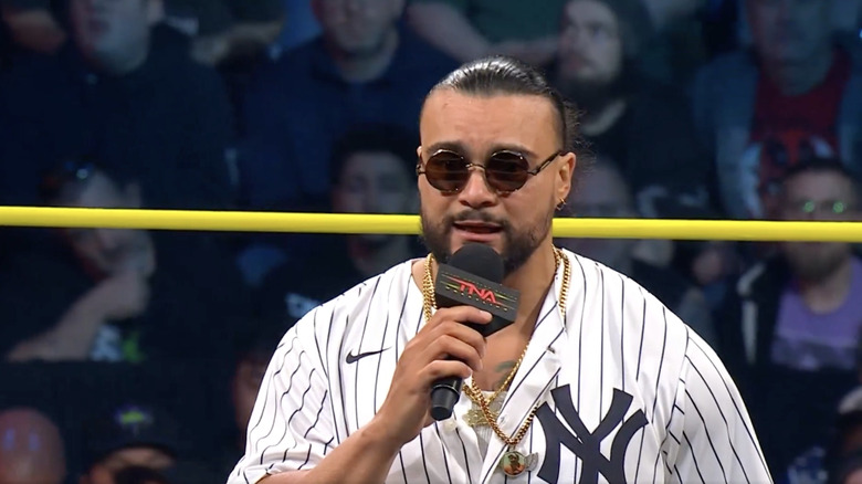 Santana talking in the ring