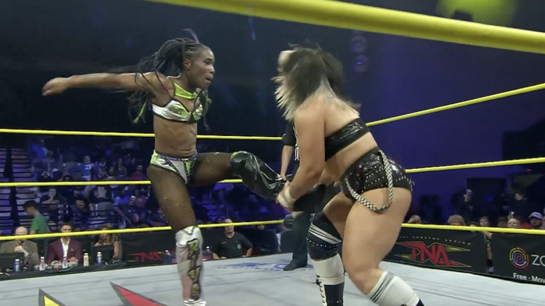 Luna catching Stone's boot