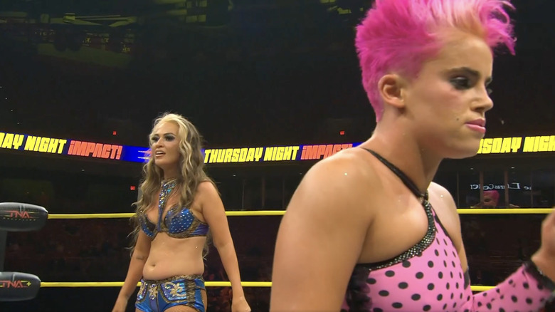 Alisha standing behind Hudson