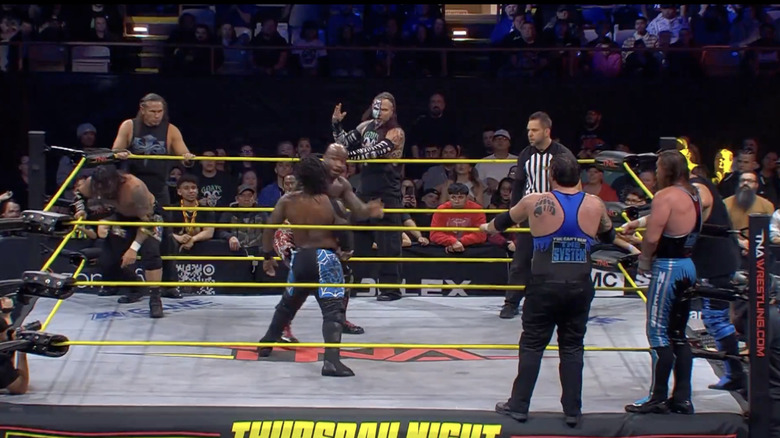 All eight men in the ring