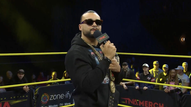 Santana talking in the ring