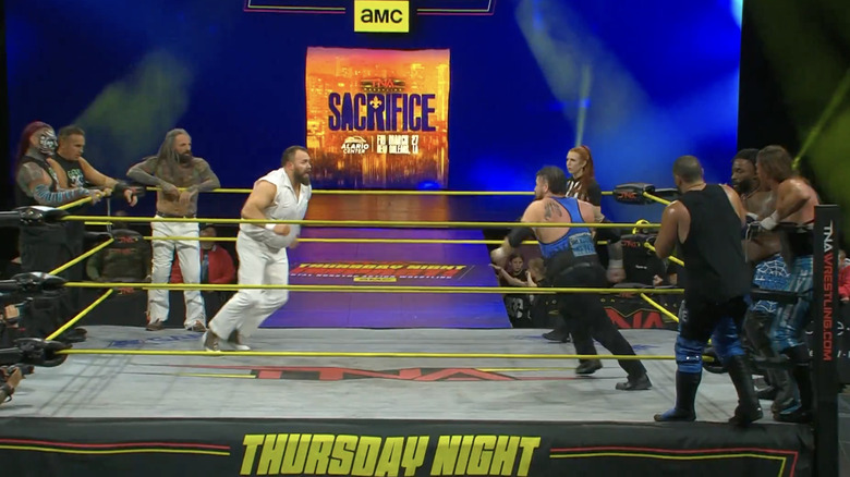 All eight men in the ring