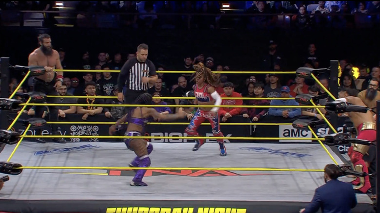 All four competitors in the ring