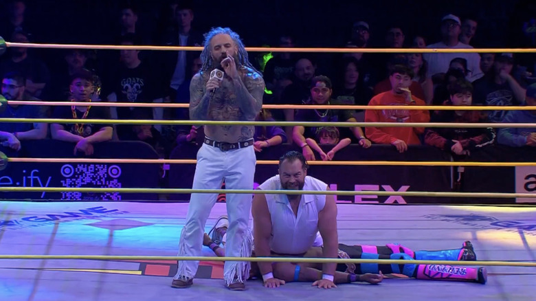 The Righteous in the ring standing over TW3