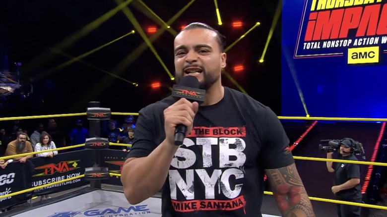 Santana talking in the ring