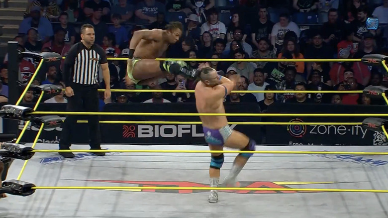 Sosa landing a dropkick on Attitude