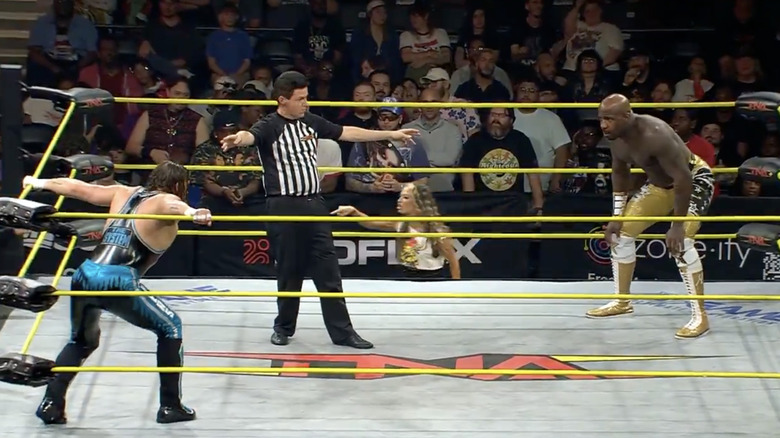 Myers and Moose inside the ring staring one another down