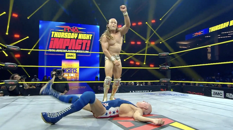 Elegance standing over Jackson