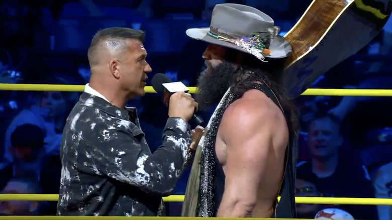 Kazarian and Elijah staring one another down in the ring