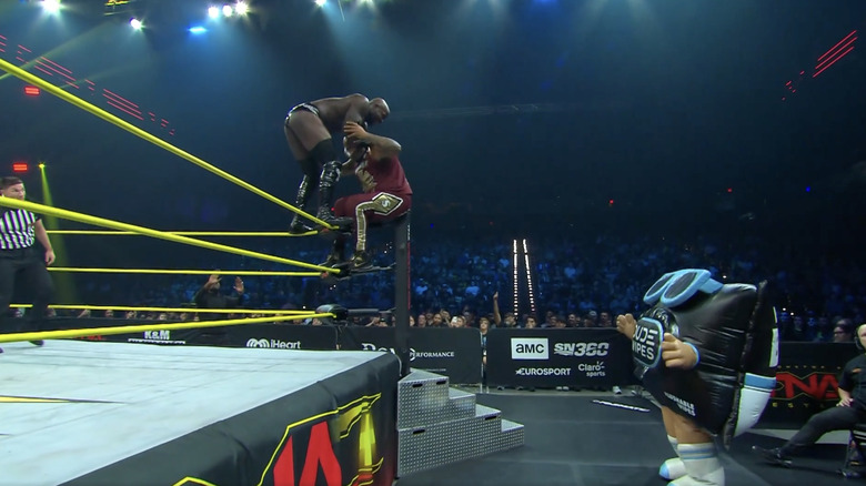 The Dude Wipes mascot watching Moose and Francis teeter on the ropes