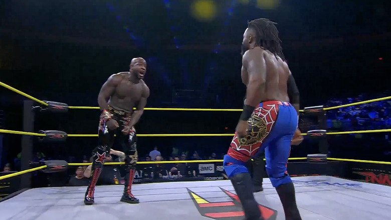 Moose and Alexander staring one another down in the ring