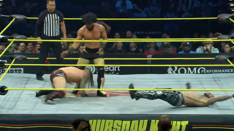 All three men inside the ring