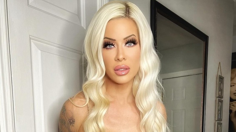 Angelina Love with white walls in the background