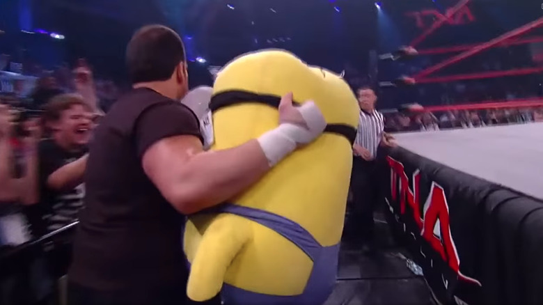 Tommy Dreamer holding a Minion plushy at TNA Victory Road 2011