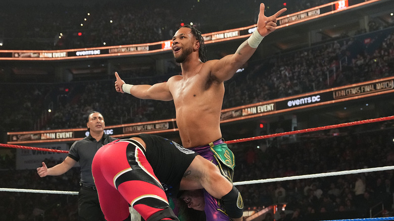 Leon Slater prepares to hit AJ Styles with a Styles Clash