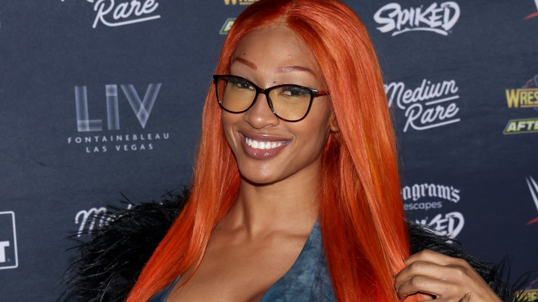 Mara Sade wearing glasses