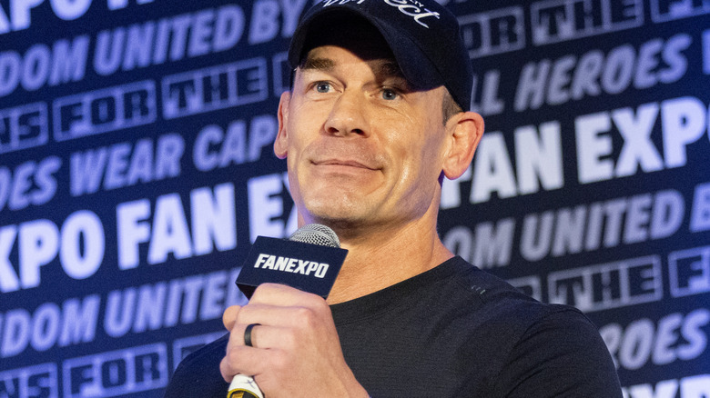 John Cena is holding a microphone