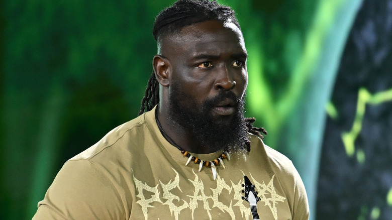 Oba Femi wearing a beige t-shirt