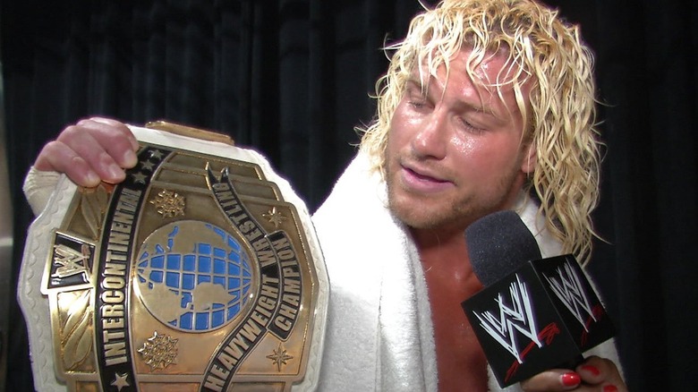 Dolph Ziggler looking at the WWE Intercontinental Championship during a backstage interview.