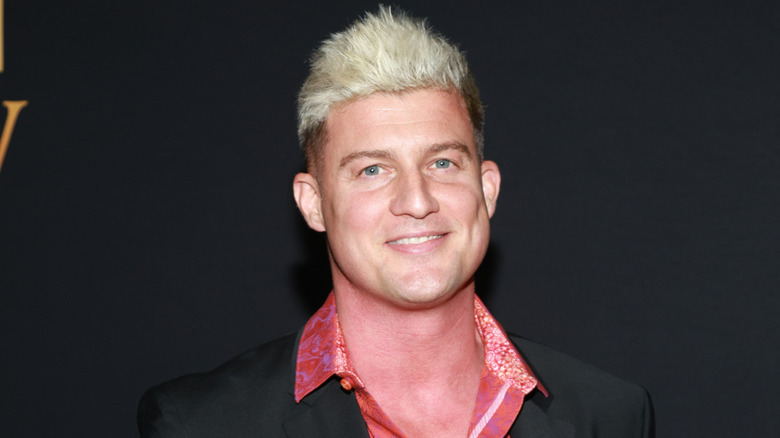 Ryan Nemeth in a suit and red shirt