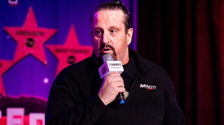 Tommy Dreamer talking into microphone