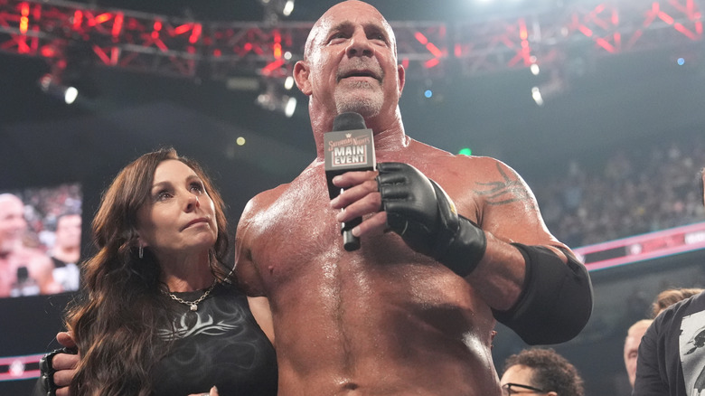 Goldberg holding a microphone