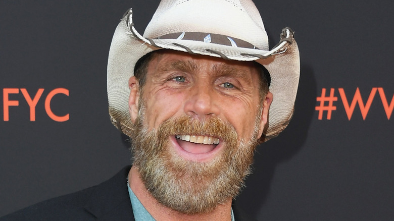 Shawn Michaels smiling in a cowboy hat