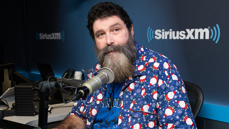 Mick Foley wearing a Christmas shirt