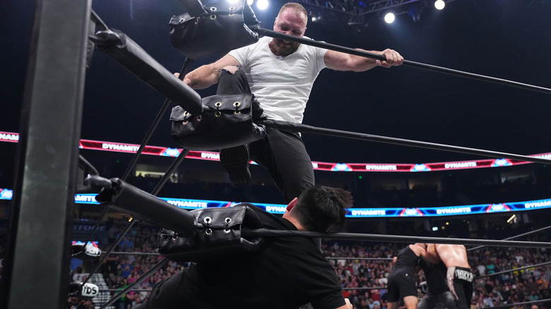 Jon Moxley stomps on Chuck Taylor during mayhem