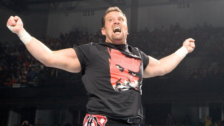 Tommy Dreamer holding his arms out and shouting
