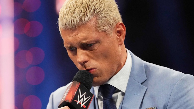 Cody Rhodes with a microphone