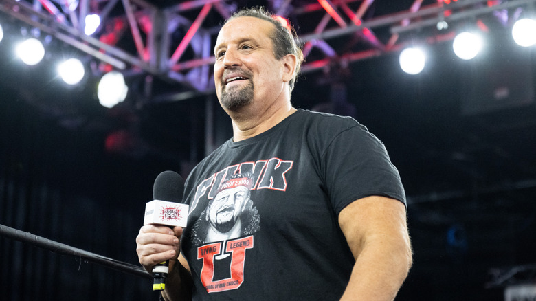 Tommy Dreamer smiles on waiting for a question from the audience during a live "Busted Open" radio event