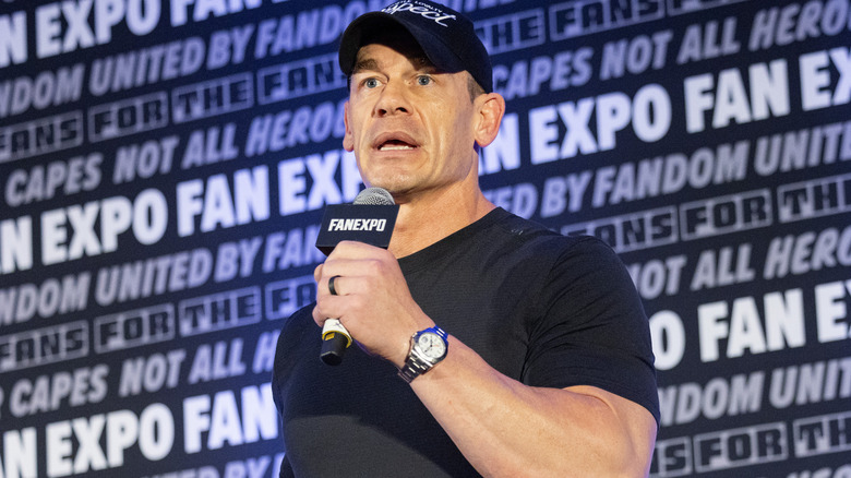 John Cena is holding a microphone