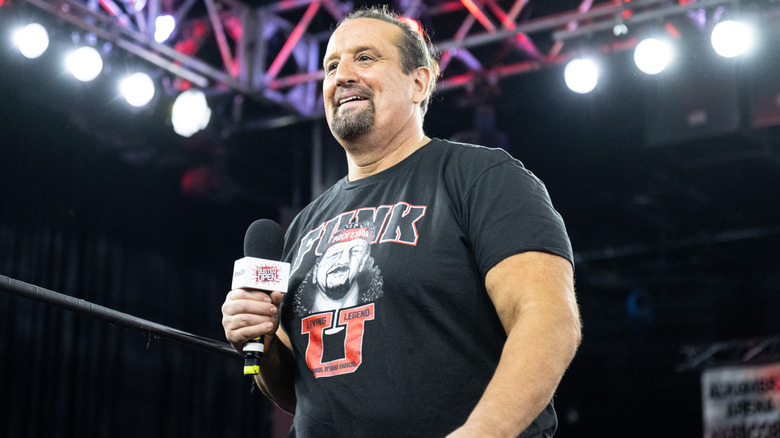 Tommy Dreamer at an event with a microphone