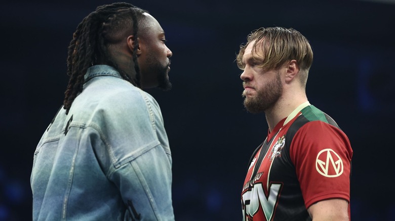 Swerve Strickland and Will Ospreay staring at each other